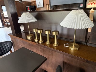 three lamps on a table in a room