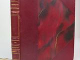 a red book that is sitting on a table