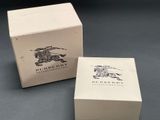 a close up of a box with a watch inside of it