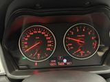 two speedometers on the dashboard of a car