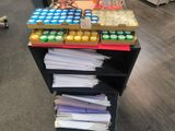 a cart with a lot of supplies on it in a store