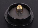 an image of a gold ring on a black surface