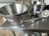 two bowls and spoons on the table in the kitchen