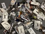 a pile of assorted electronic devices on a table