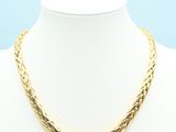 a gold necklace on a mannequin mannequin mannequin mannequin mannequin mann