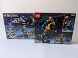 deux boîtes de lego technic sur une surface blanche