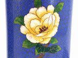 an image of a blue vase with a yellow rose painted on it