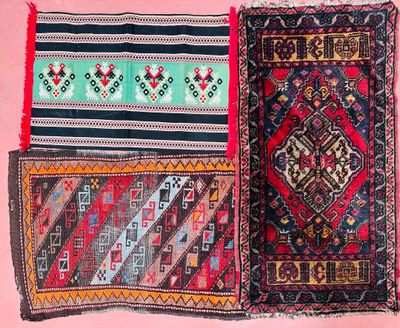 two rugs with different colors and patterns on a pink background