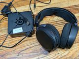 a pair of headphones sitting on a wooden table