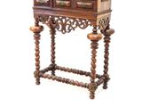 a small wooden cabinet with a bird cage on top