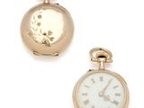 two gold pocket watches with roman numerals and roman numerals on them