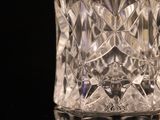 a glass vase that is sitting on a table