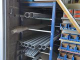 a lot of pipes that are stacked up in the garage