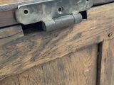 a close up of a wooden door with a latch on it