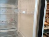 an open refrigerator with the door open in the kitchen