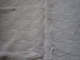 an image of a bed with a blanket on it