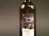 a bottle of wine that is sitting on a table