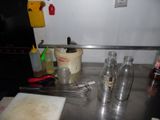 a kitchen counter with a lot of utensils on it