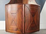 a wooden cabinet that has a door on it
