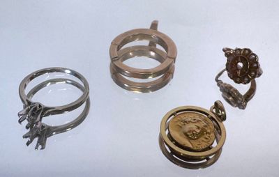 three rings and a ring with a picture of a woman ' s face