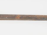 a piece of wood that is laying on a white surface