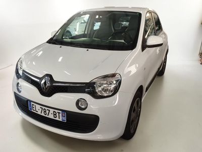 a white car that is parked in a white room
