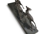 statue of a man on a horse and a woman on a horse