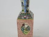 a vase with a picture of a man and a woman on it