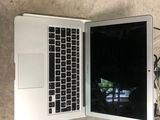 two laptops that are open on the floor