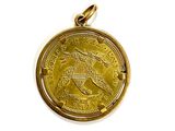 an image of a gold coin with a horse on it ' s back