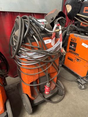 many different types of welding equipment in a garage