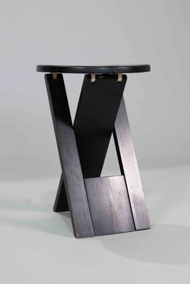 the table is made of wood and has a black top