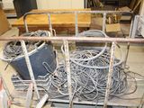 a pile of wires on a cart in a room