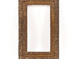 an old picture frame with a white background and a white wall