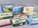 a lot of model airplanes and boxes on the table