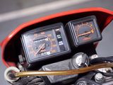 a close up of a motorcycle with a speedometer and gauges on it