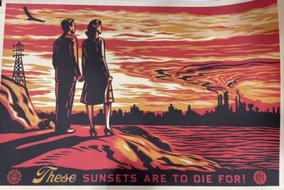 poster of two people standing on a rock with a sunset in the background