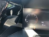 the dashboard of a car with a digital display on it
