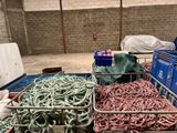 many different types of fishing nets in a storage area