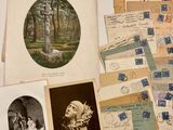 a table with many old postcards on it