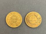 two gold coins, one of which is a sovereign and one of which is a sovereign