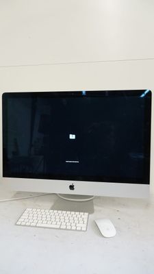 a computer on a desk with a keyboard and mouse