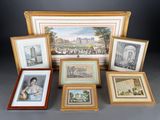 a group of framed and unframed prints