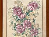 painting of a bouquet of flowers in a wooden frame on a wall