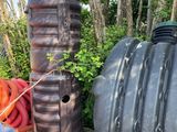 many different types of water tanks sitting on a pallet