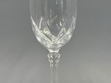 an empty wine glass sitting on top of a table