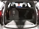 the back of a car with the trunk open and the seats folded down