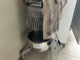 a laundry basket with a towel on top of it in the corner of a room