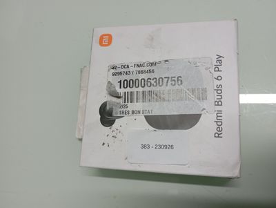 a white box with a barcode on it sitting on a table