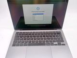 a laptop that is open on a white table